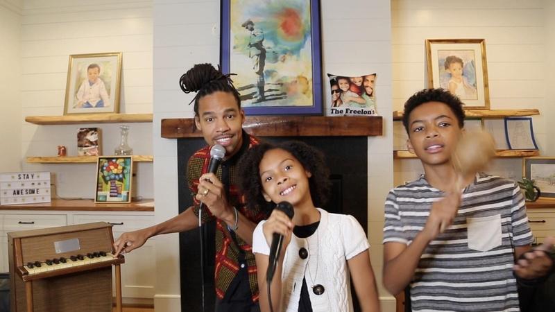 Prince Freelon and his children singing and playing musical instruments.