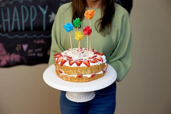 Cake with pom pom cake toppers.
