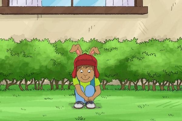 Bud is learning to tie his shoes.