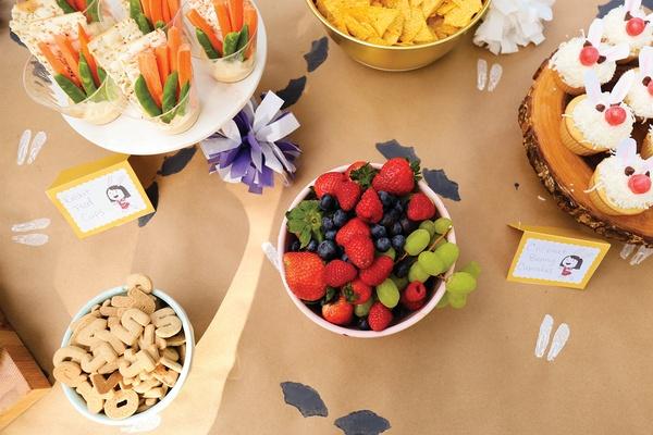 A table with a bunny ear stamped tablecloth.