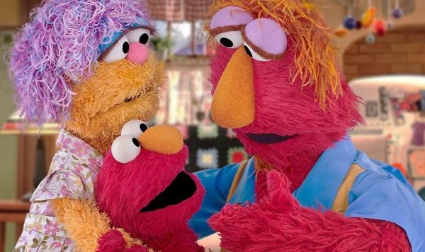 Image of Elmo hugging his parents.
