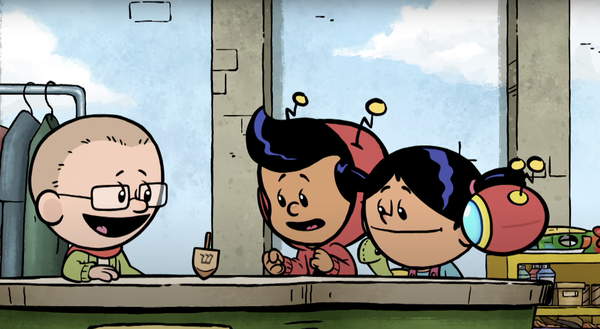 Brad, Xavier, and Yadina watch a dreidel spin on a table.