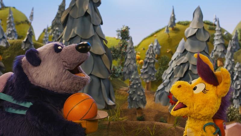 Purple Panda and Donkey Hodie play with a ball.