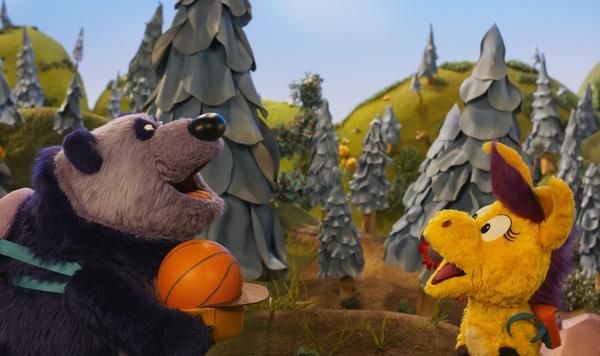 Purple Panda and Donkey Hodie play with a ball.