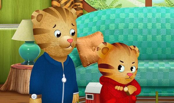 Dad Tiger looks at Daniel Tiger who is mad.