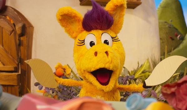 Donkey Hodie making an art project.