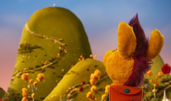 Donkey Hodie looking at a mountain.