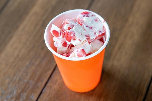 Cup with FroYo bites and toppings.