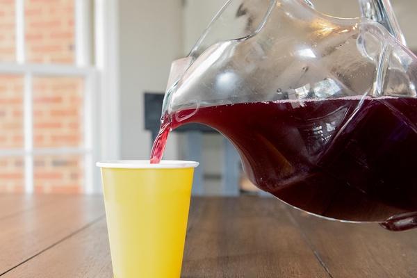 Planet Purple Party Punch is poured from a pitcher.