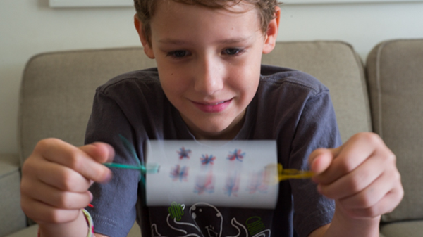 Child looking at Thaumatrope