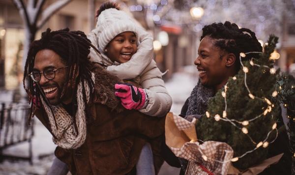 Young family walking outside in the snow.