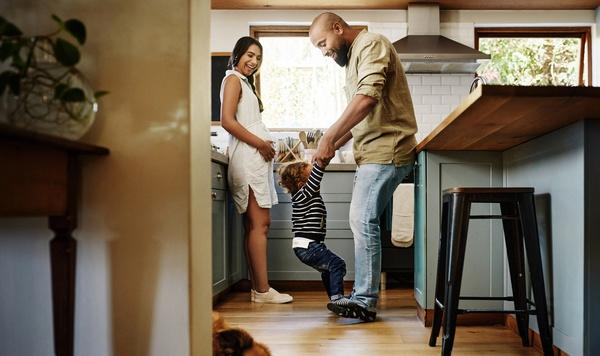 Family dancing in the kitchen.