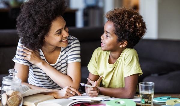 Image of mom and daughter doing homework.