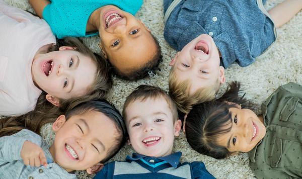 Group of children all in a circle.