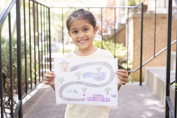 A child holds her map.