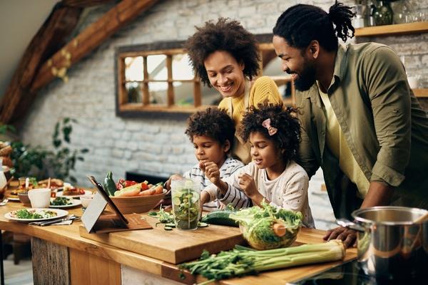 A family making a healthy meal together.