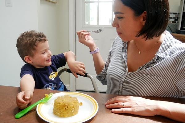 A mother and son enjoy mofongo together.