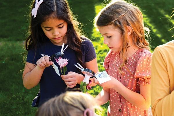 Children playing with magnifying glasses.