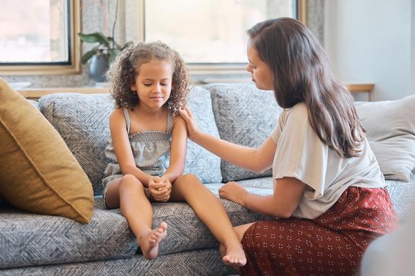 An adult and child in a calm discussion.