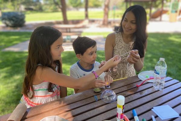 A family plays Molly's bartering game.