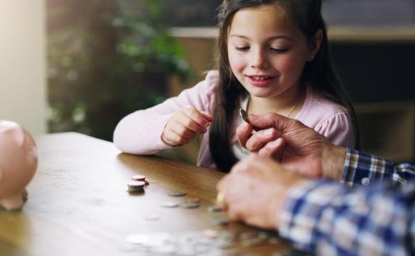 young girl counting coins