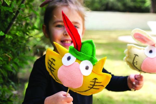 A child plays with Nature Cat stuffed toys.