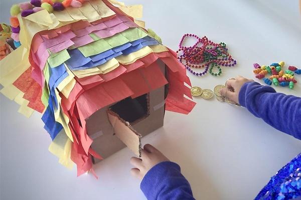A child adds prizes to their no-break pinata.