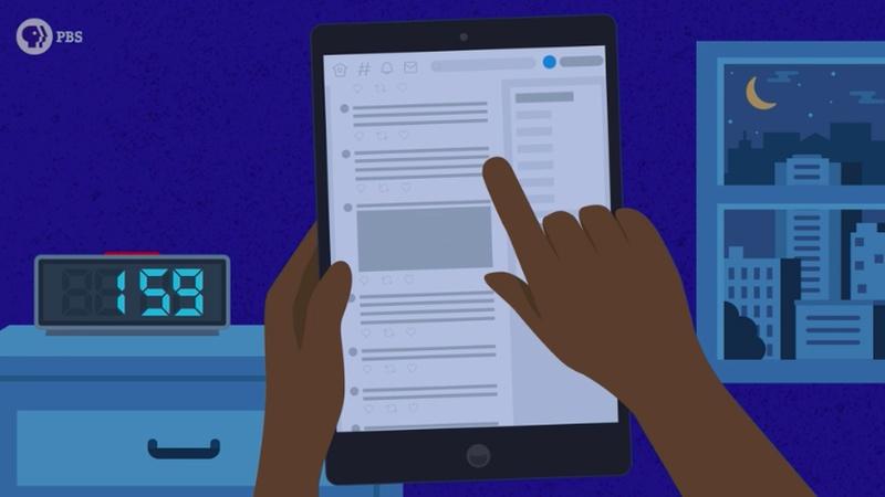 person scrolling on tablet at night