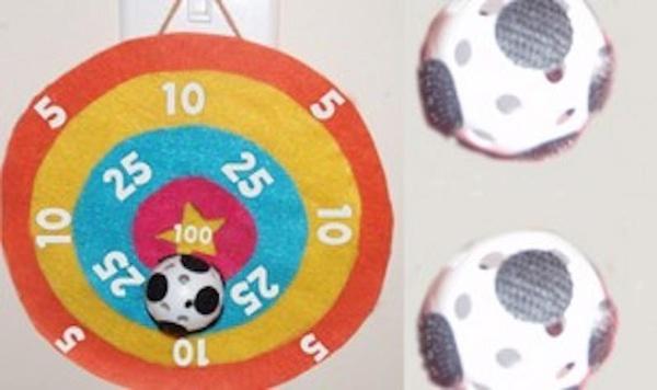 Image of velcro bullseye and ball game feature