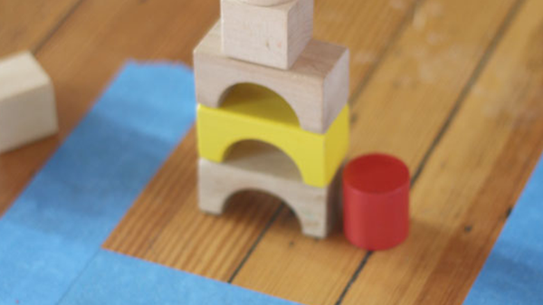 blocks stacked next to a line of tape