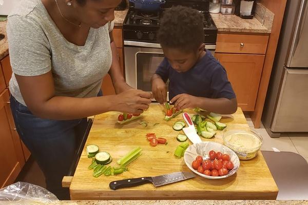 A mother and son make a healthy snack while doing this Wild Kratts snail recipe.