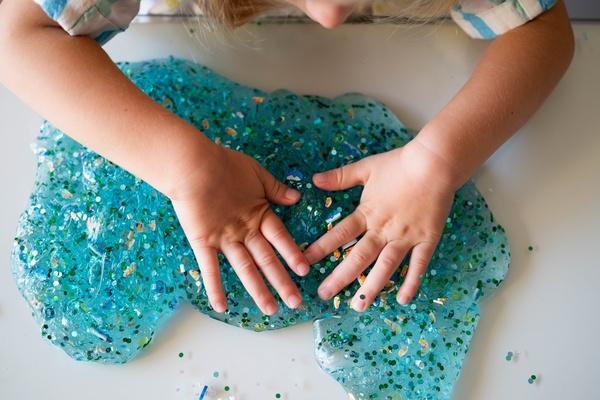 Child playing with homemade slime.