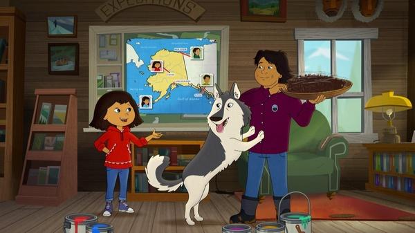 Molly, Molly's Dad, and Molly's dog standing in front of a map of Alaska.