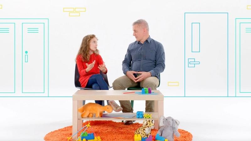 Daughter and dad sitting in chairs talking about changes at school.