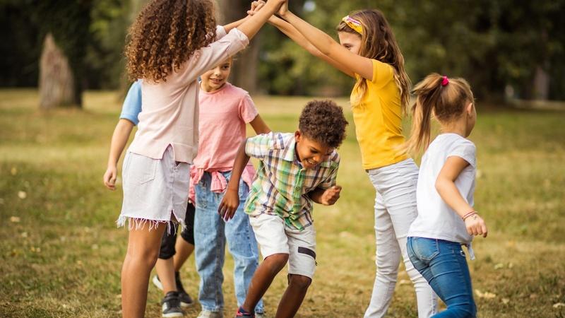 Kids playing a game on the playground.