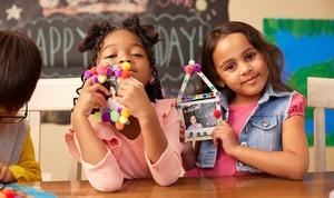 Children showing off picture frames they made at an Alma's Way birthday party.