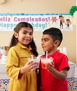Children drinking fruit flavored piragua drinks.