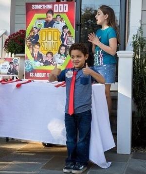 Child at Odd Squad birthday party wearing tie