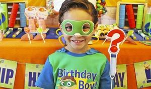 Birthday kid with Super Why birthday party mask and why writer