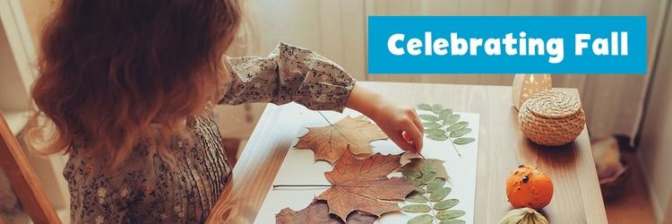 Little girl creating art with leaves.