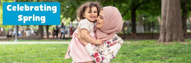 Mother and daughter having a picnic in a park.
