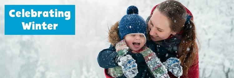 Image of mother and child in the snow.