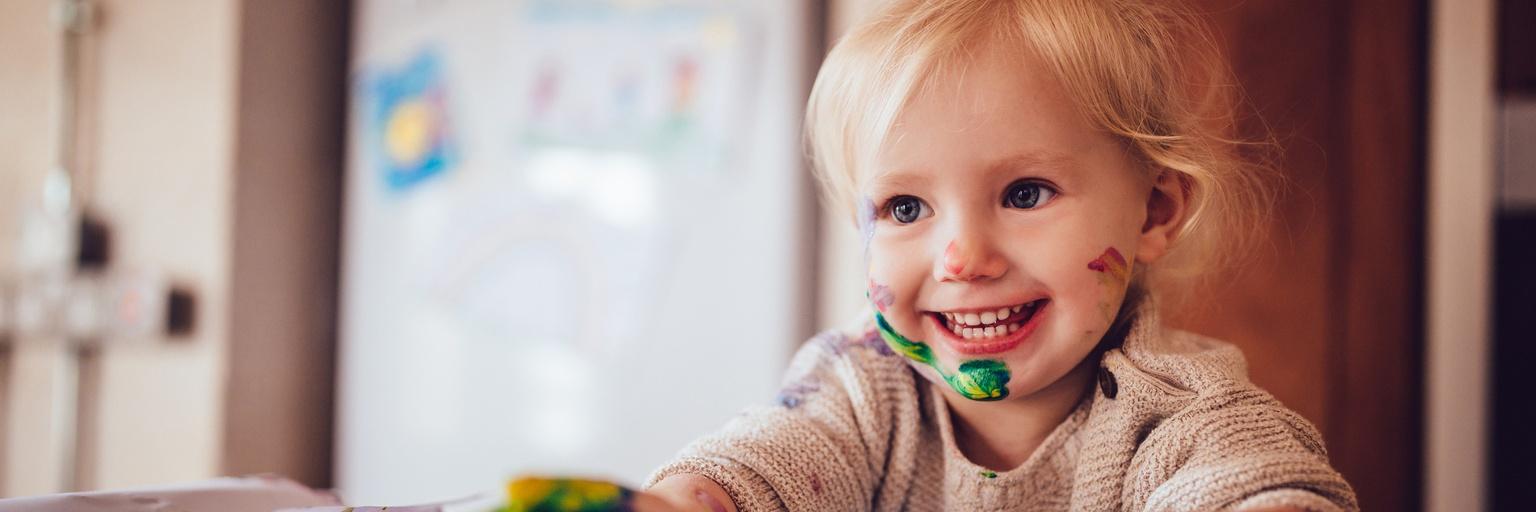 Image of toddler finger painting.