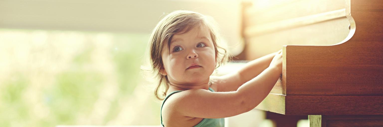 Image of little girl playing piano.