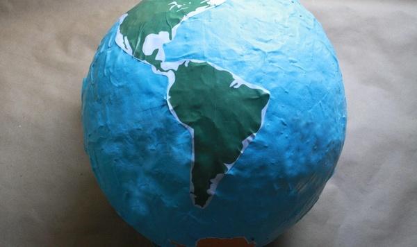 Paper mache globe on table, featuring South America