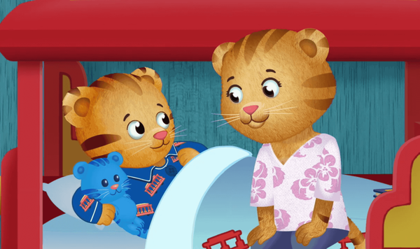 Image of Mom Tiger tucking Daniel Tiger into bed.