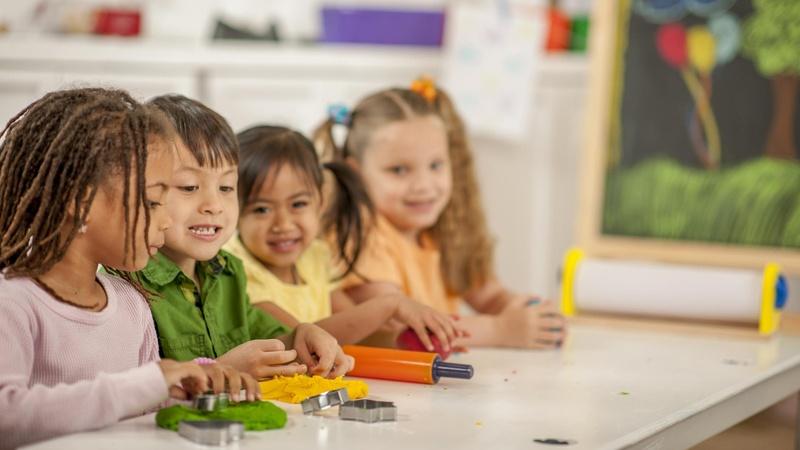 Image of children playing with playdough.