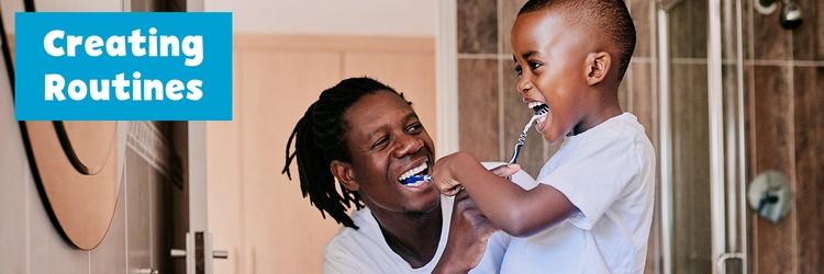 Father and son brushing their teeth together.