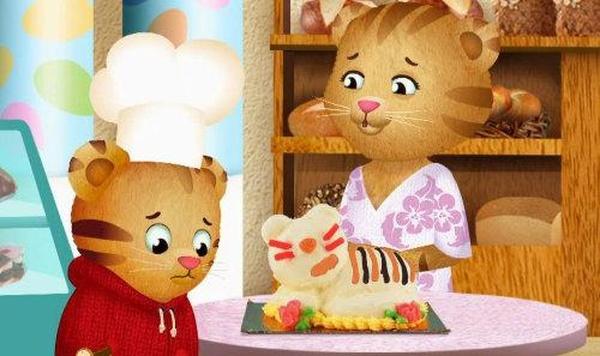 Image of Daniel and Mom Tiger with his birthday cake.