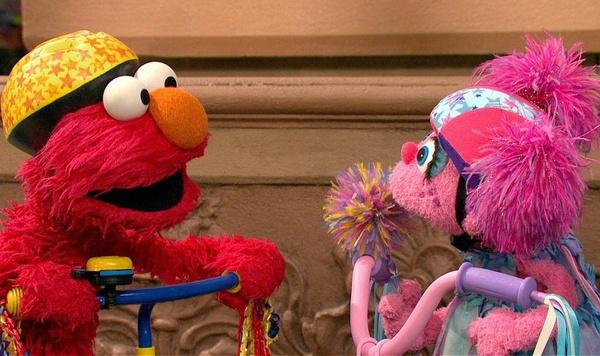 Image of Elmo and Abby playing.